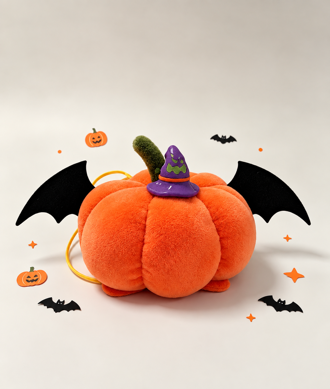 Plush pumpkin bat pet headpiece in a Halloween setting